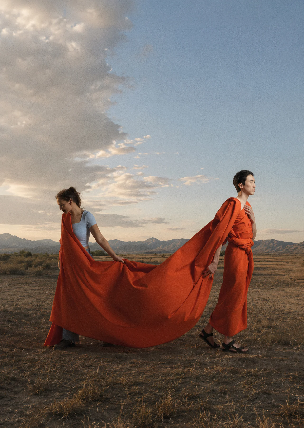 Lena and Eres in the Tuva steppe, joined by a long red cloth